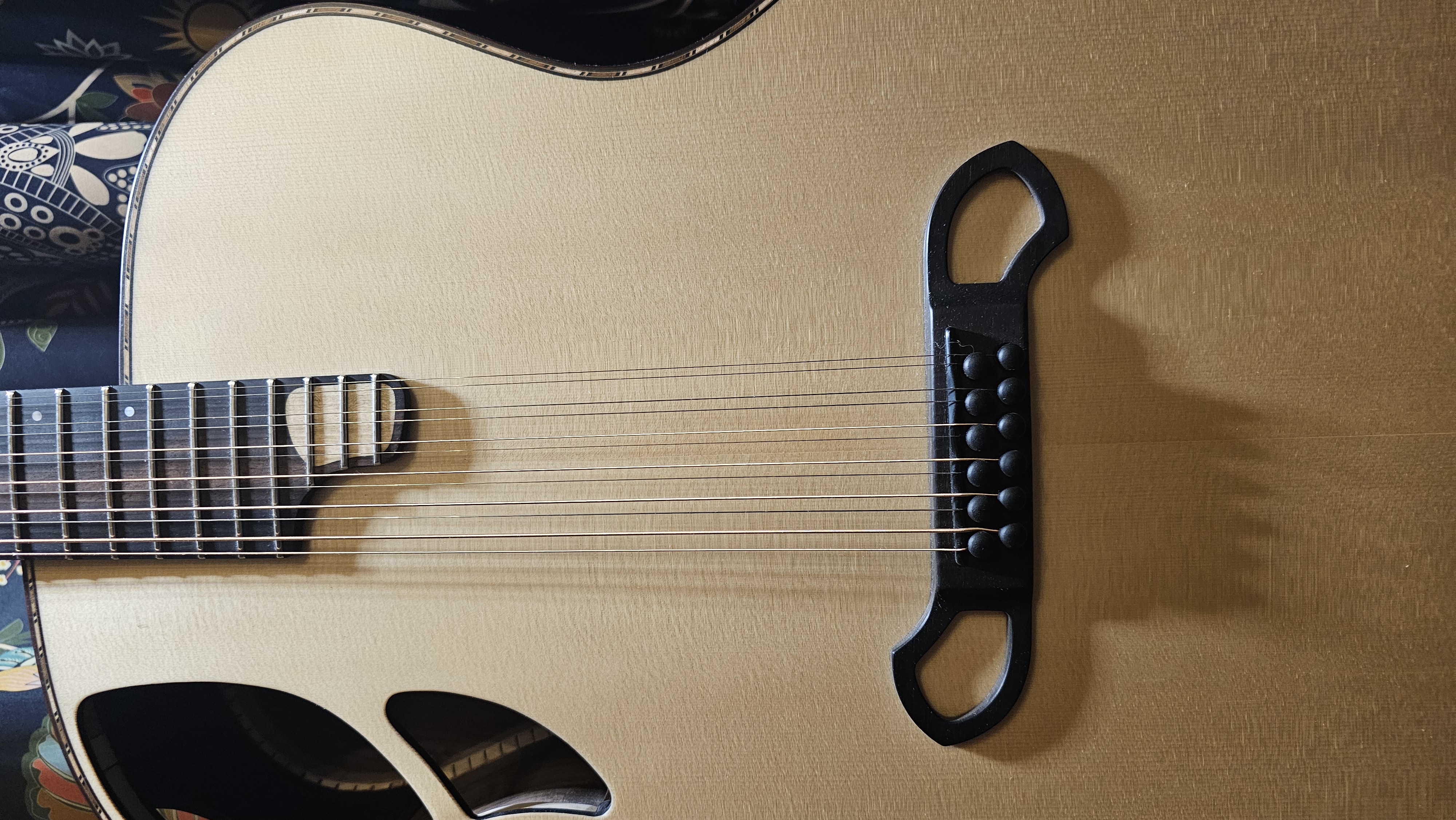 Ebony bridge and pegs, with buffalo horn saddle